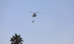 Şam'da devrimin başlangıç yıl dönümü ilk kez kutlandı, helikopterlerle halka gül dağıtıldı